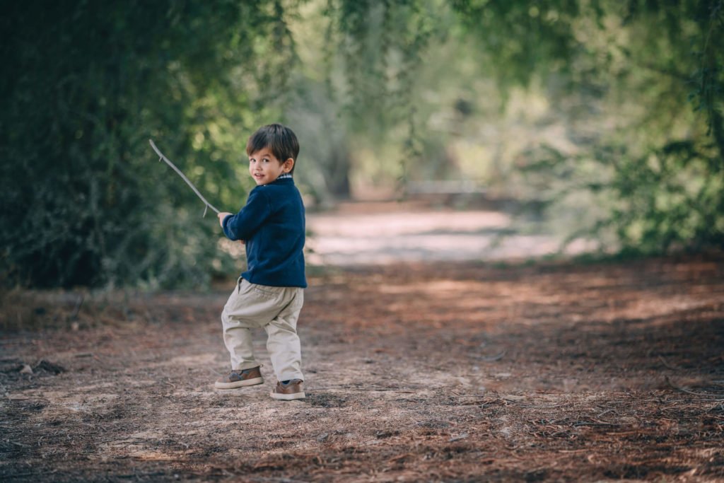 Modern photography: A boy running in the park in Dubai