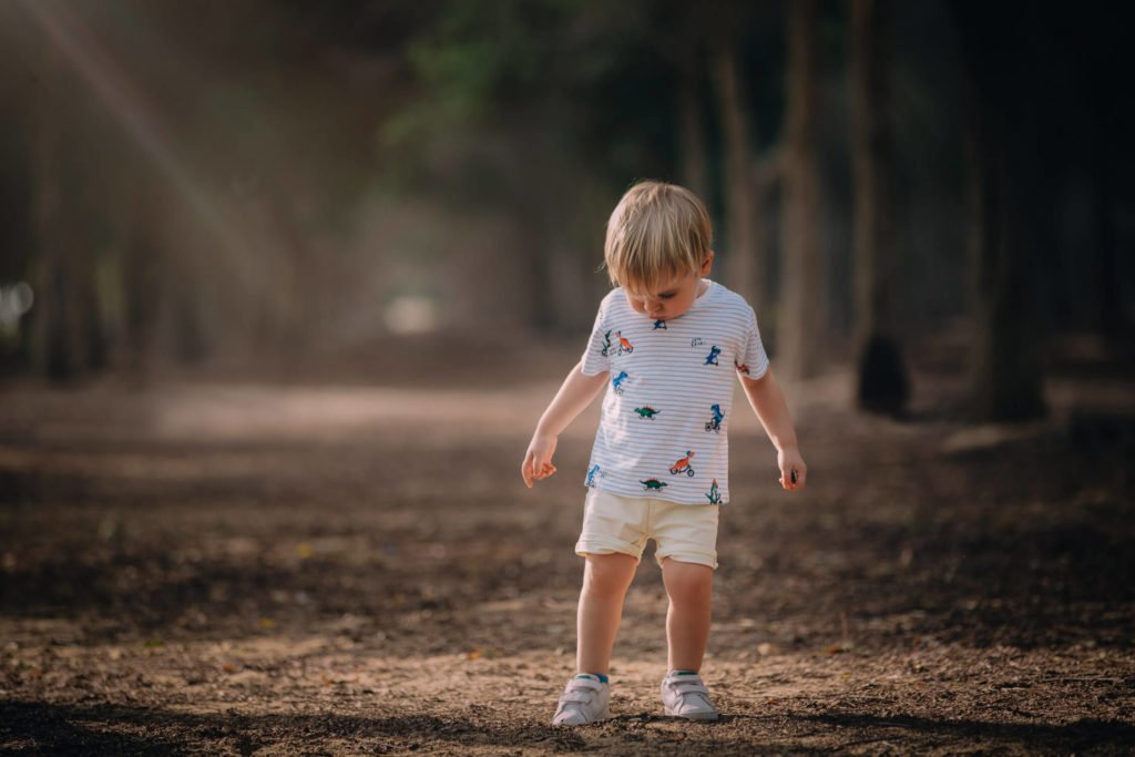 Gorgeous natural portrait: A boy standing in the park in Abu Dhabi