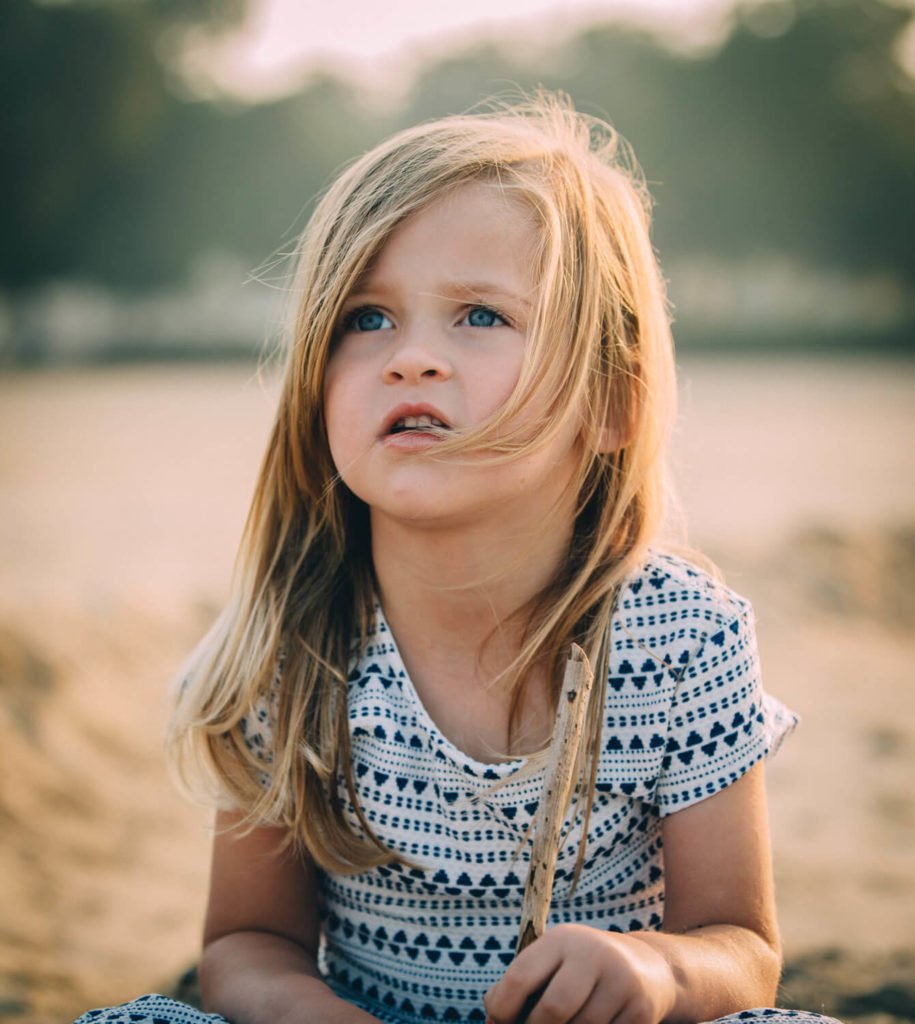 Beautiful kid photography of a girl in the beach of Abu Dhabi