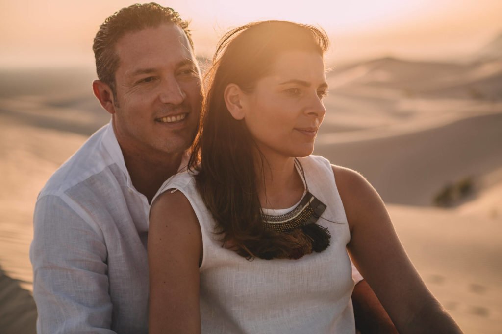 A couple during desert sunset in Dubai