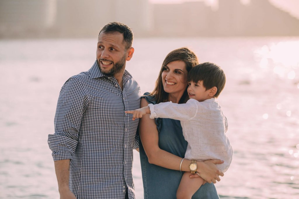 Father, mother and son at the beach in Abu Dhabi