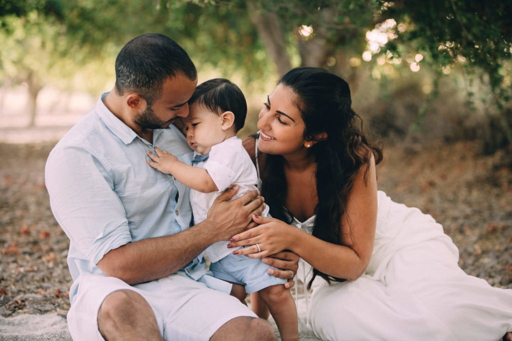 Mum, dad and their baby boy hug altogether in Dubai