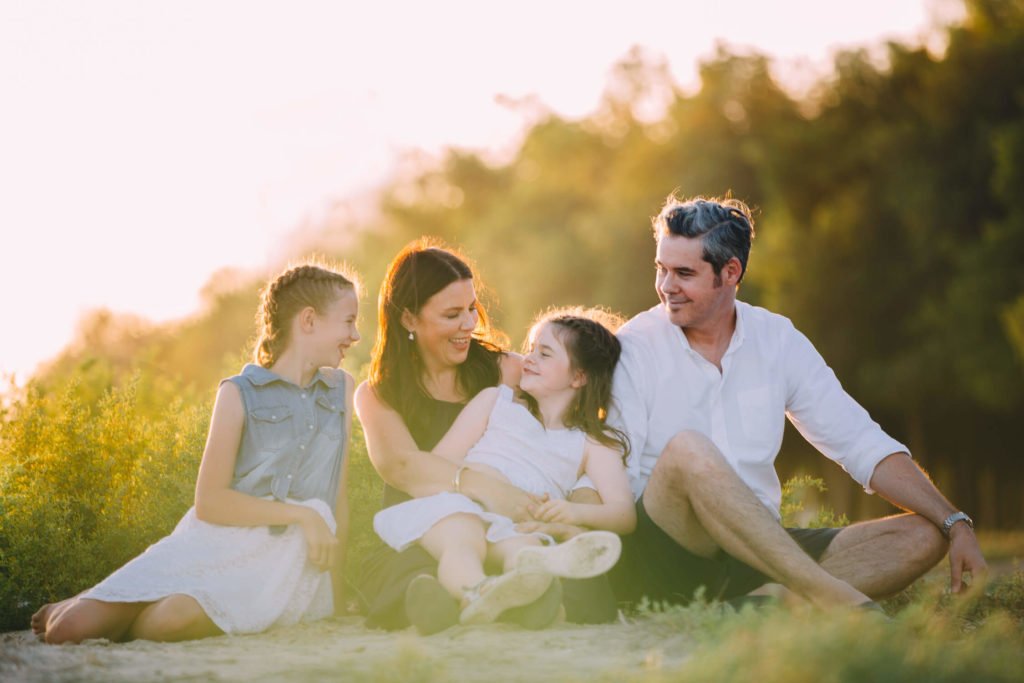 An Australian family with a teen and a tween during sunset at the beach in Abu Dhabi