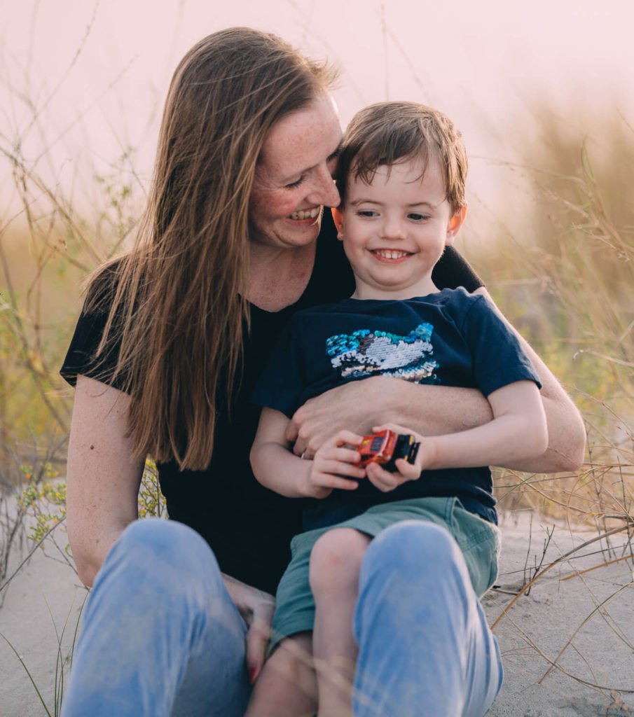 In the beach of Abu Dhabi a mum and her little boy are laughing