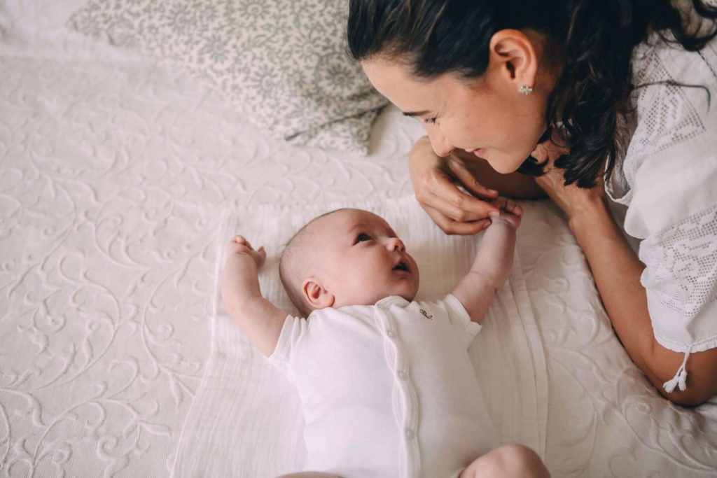 Mother and baby look at each other