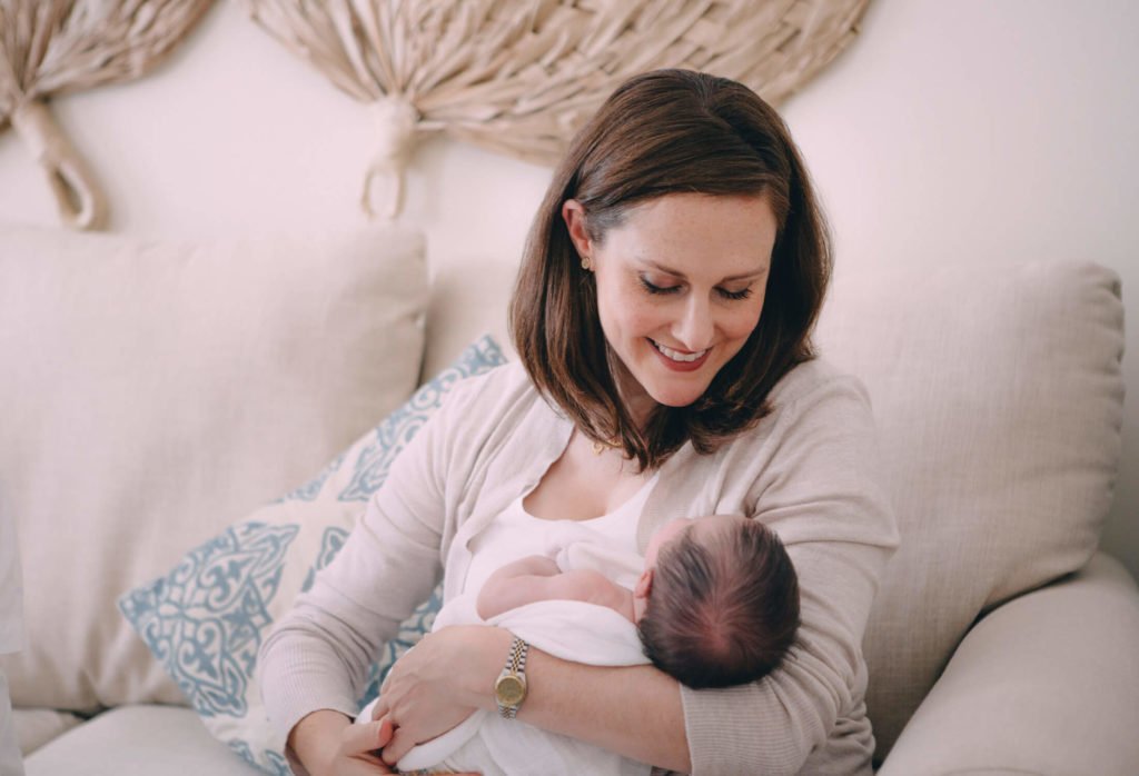 Mum is looking at her newborn baby