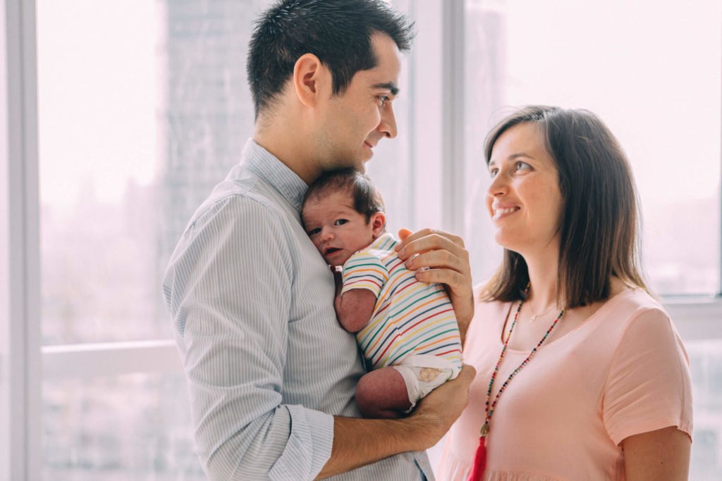 Family of three, mum, dad and their newborn in Dubai