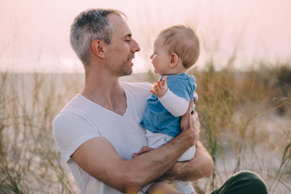 A dad and his baby boy at the beach in Abu Dhabi