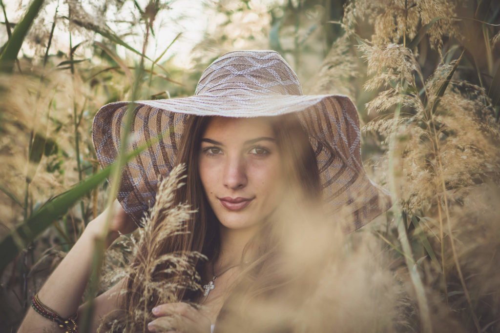 beautiful teenage girl wearing a boho hat in Dubai