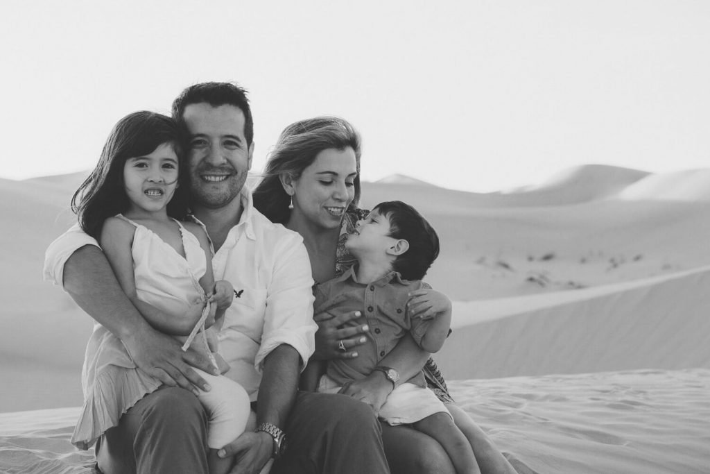 Portrait of a family in the sand dunes of Abu Dhabi