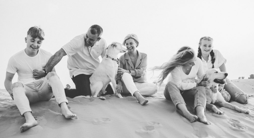 A family having fun with their dogs in the desert of Dubai and Abu Dhabi 
